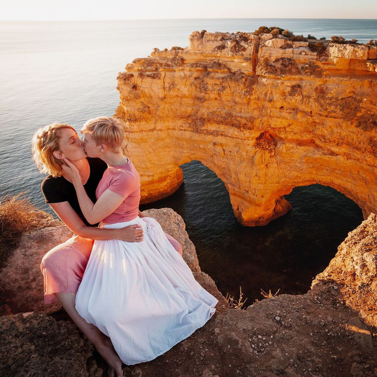 Couple of girls kissing in Lagos, Portugal