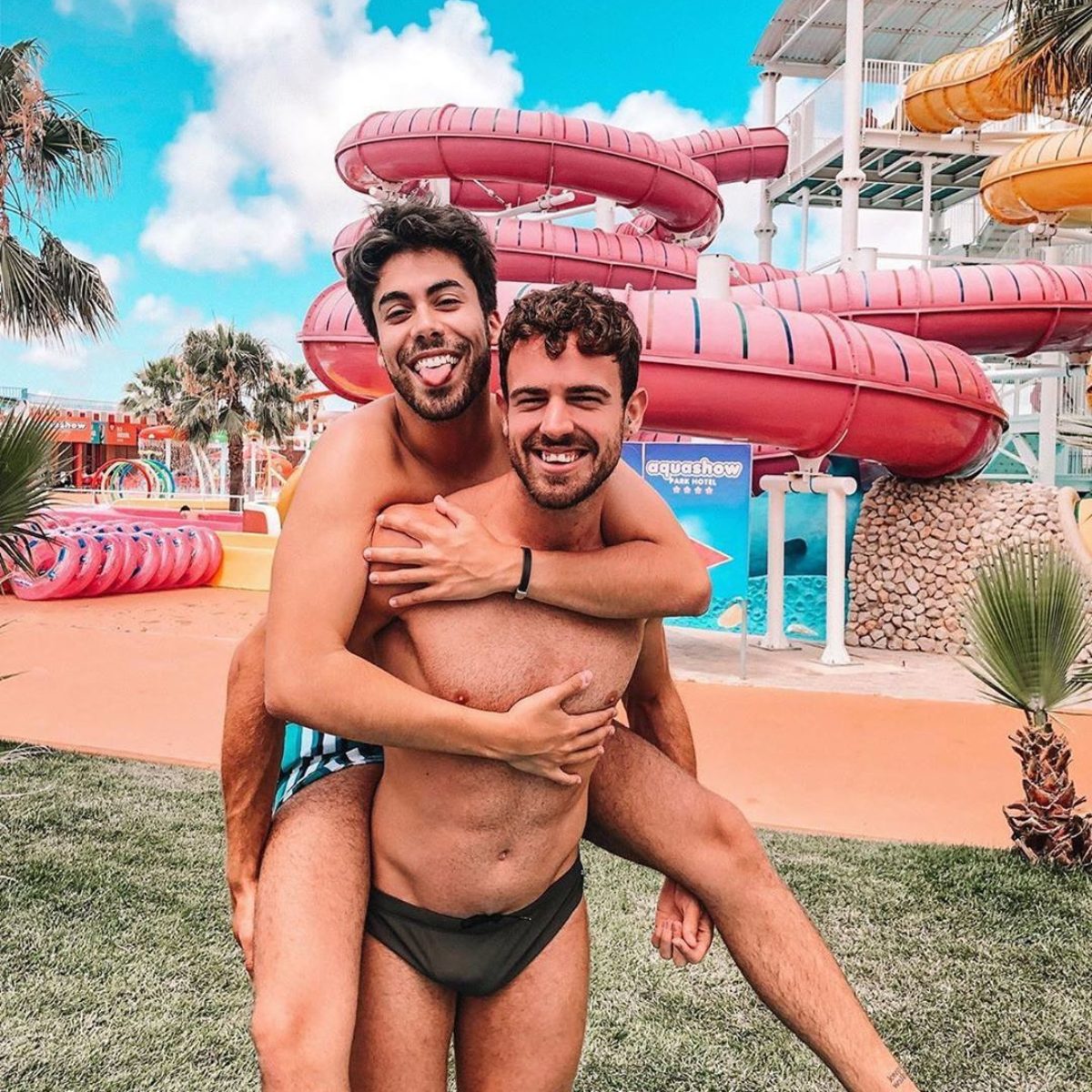 Couple of men having fun at water park in Algarve, Portugal