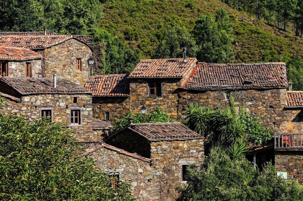 Rural houses in the middle of the vegetation in Portugal, looks like a movie set.
