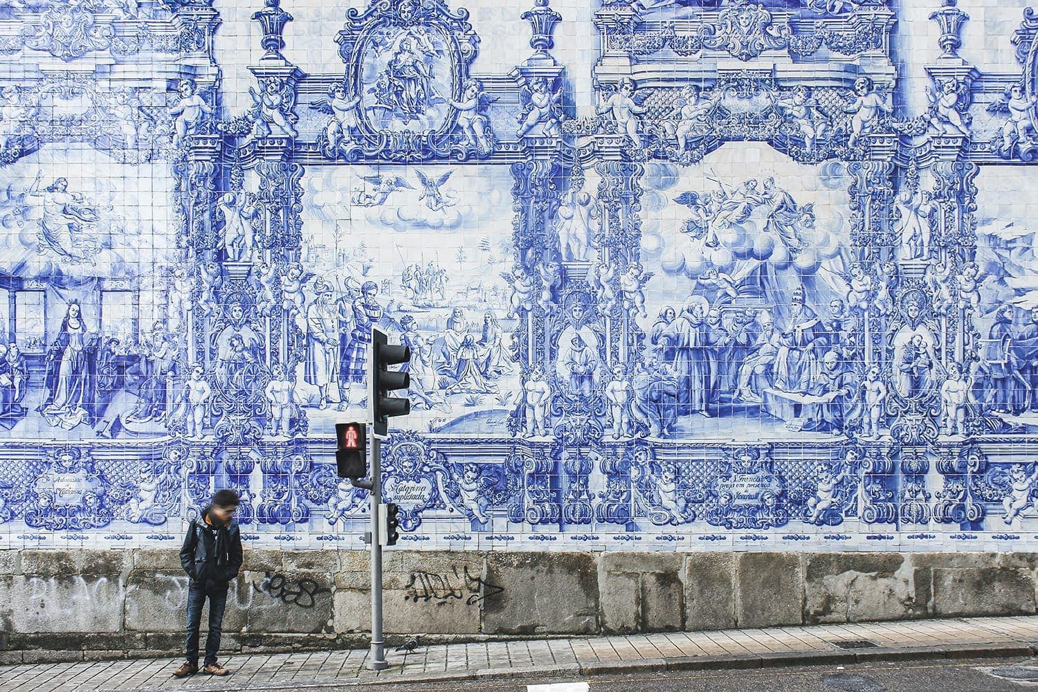 Facade of the "Chapel of Souls" in Santa Catarina, Porto, filled with historical and cultural blue and white tiles
